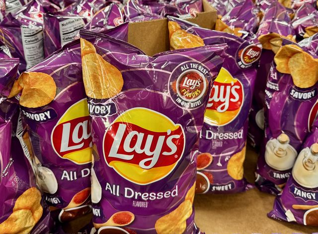 Many bags of Lays All-Dressed Potato Chips