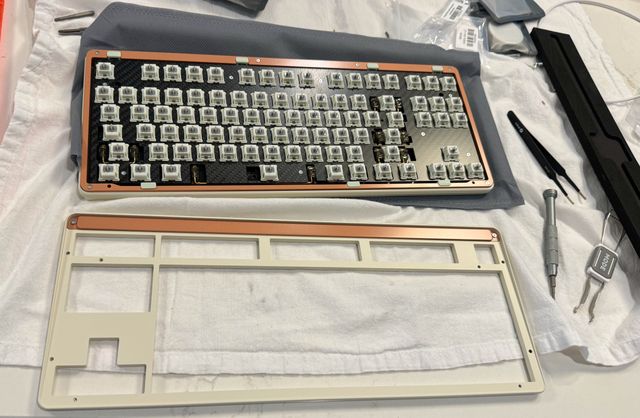 A computer keyboard, partially assembled