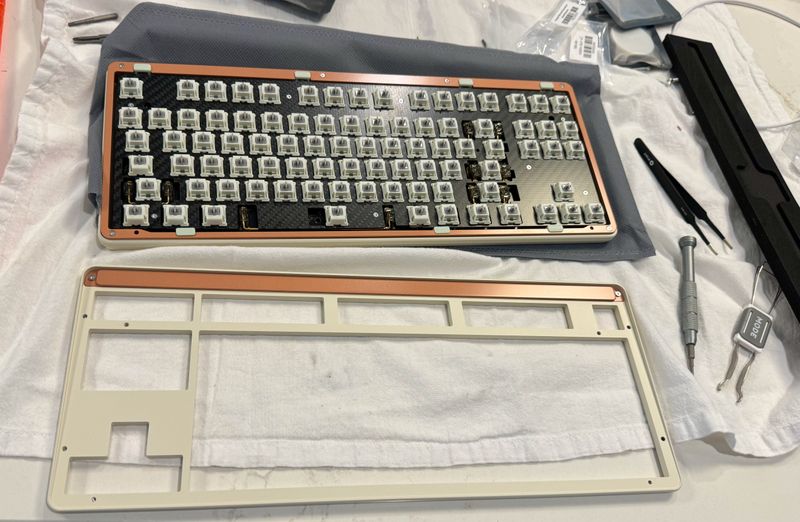 A computer keyboard, partially assembled